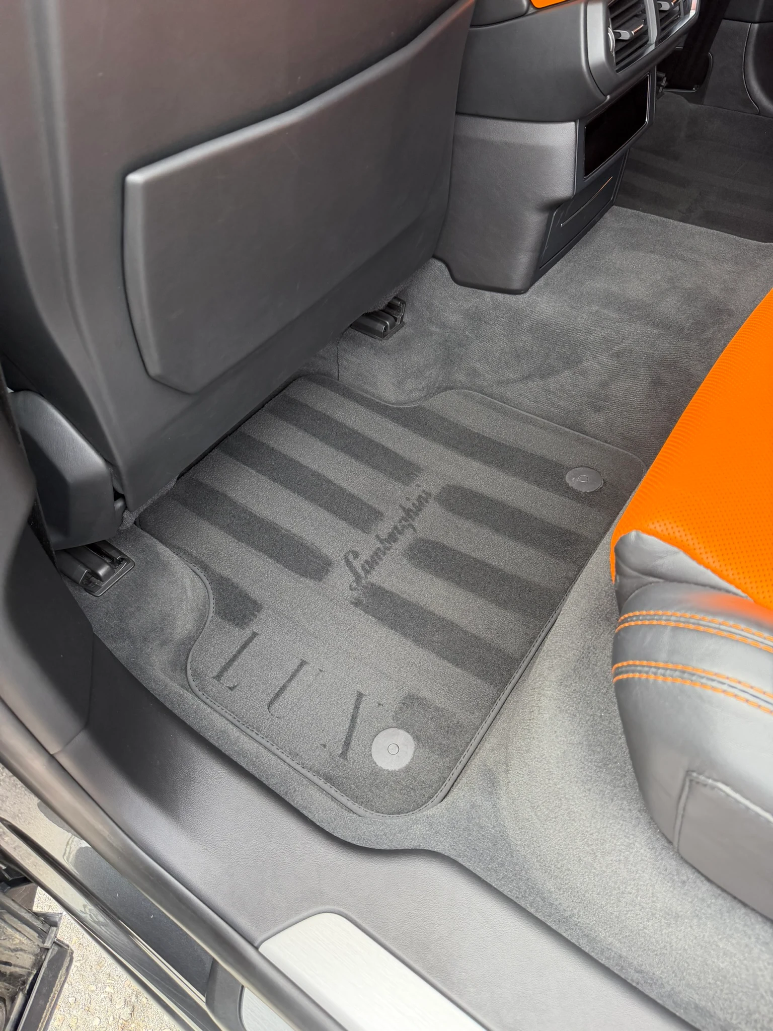 Finished stencil result on a striped rear car mat