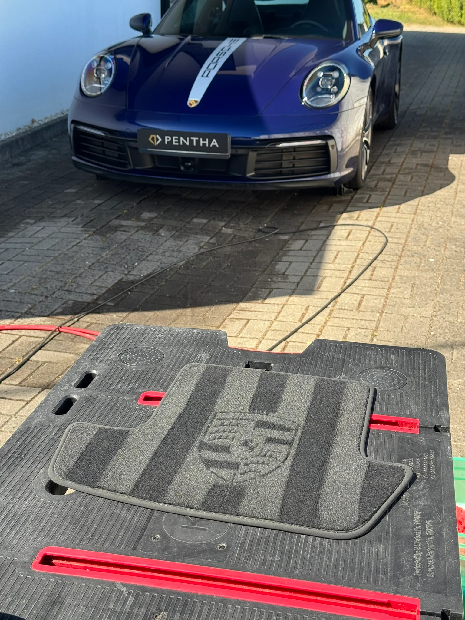 Finished shield stencil result on a detailed car mat